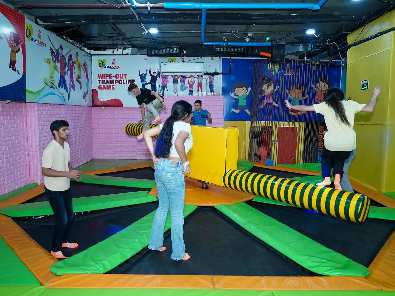 kids playing wipe out at skyjumper