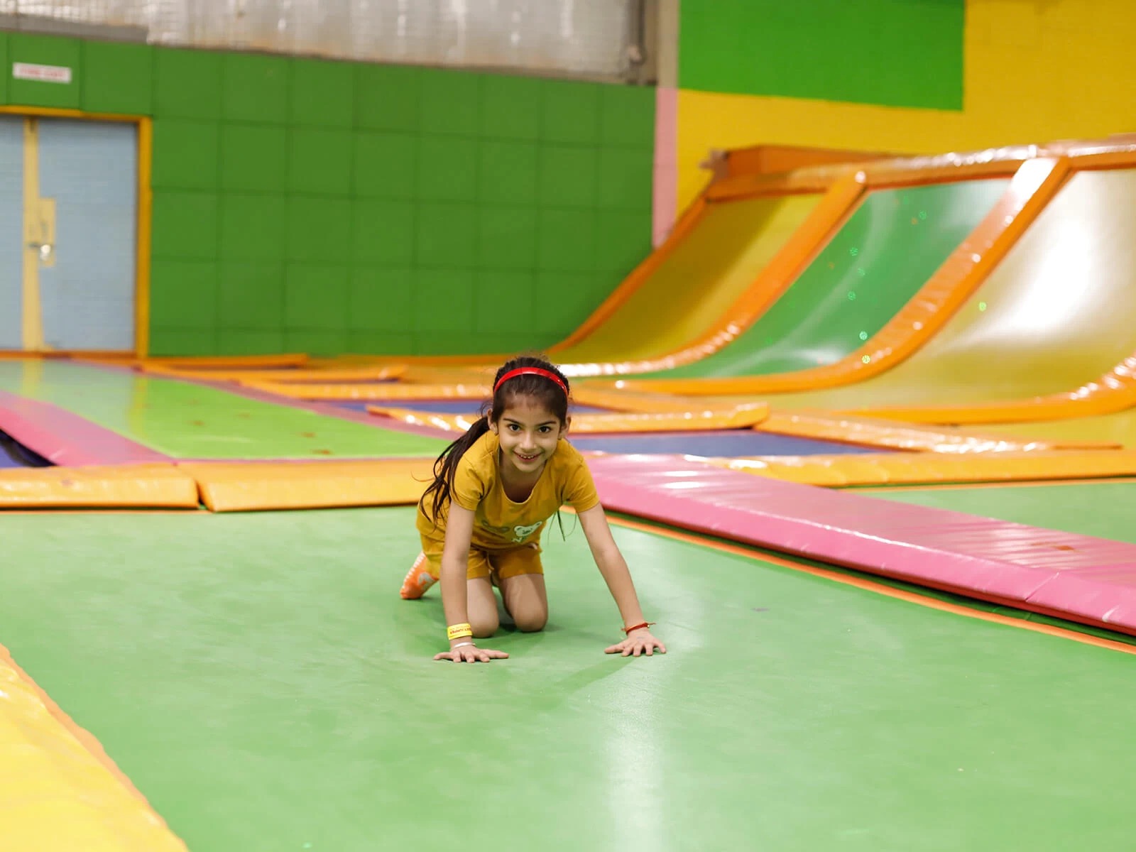 a girl sitting on trampoline